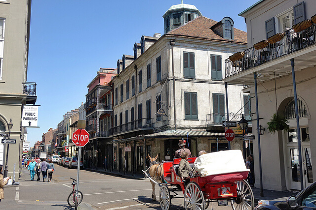 A carriage rolls past Napoleon House in the French Quarter. (Photo: Paul Broussard)